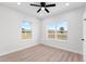 Bright bedroom with ceiling fan and wood-look floors at 6085 Lightsey Rd, Fort Meade, FL 33841