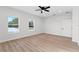 Bedroom with hardwood floors and two large windows at 6085 Lightsey Rd, Fort Meade, FL 33841