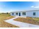 Front view of a newly built home at 6085 Lightsey Rd, Fort Meade, FL 33841