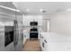 Modern kitchen with stainless steel appliances and white cabinets at 6085 Lightsey Rd, Fort Meade, FL 33841