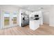 Modern kitchen with stainless steel appliances and white cabinets at 6085 Lightsey Rd, Fort Meade, FL 33841
