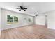 Bright living room with hardwood floors and windows at 6085 Lightsey Rd, Fort Meade, FL 33841