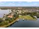 Expansive aerial view showcases luxury homes with private docks along a serene lakefront community at 7833 Freestyle Ln, Winter Garden, FL 34787
