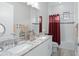 Bright bathroom with a double vanity, granite countertops, and a shower-tub combination at 7833 Freestyle Ln, Winter Garden, FL 34787