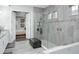 Bathroom featuring a walk-in shower, soaking tub, double sink vanity, and a view of the bedroom at 7833 Freestyle Ln, Winter Garden, FL 34787