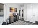 Relaxing bonus room with a TV, built-in cabinets, and adjacent access to the kitchen at 7833 Freestyle Ln, Winter Garden, FL 34787