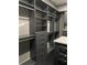 Organized walk-in closet with modern gray shelving and drawers, providing ample storage space at 7833 Freestyle Ln, Winter Garden, FL 34787