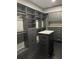 Spacious walk-in closet featuring custom shelving, drawers, and modern finishes at 7833 Freestyle Ln, Winter Garden, FL 34787