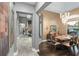Open concept dining room with hardwood floors and modern chandelier at 7833 Freestyle Ln, Winter Garden, FL 34787