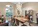 Elegant dining room featuring a wood table, chandelier, and floor-to-ceiling china cabinet at 7833 Freestyle Ln, Winter Garden, FL 34787
