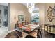 Bright dining room features a wood table and modern chandelier at 7833 Freestyle Ln, Winter Garden, FL 34787