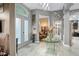 Spacious entryway with glass-top table and views to other rooms at 7833 Freestyle Ln, Winter Garden, FL 34787