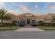 Stunning single-story home with a tile roof, stone accents, and a beautifully landscaped front yard with 2 cars in the drive at 7833 Freestyle Ln, Winter Garden, FL 34787