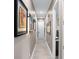 Bright hallway with light gray walls and tile flooring at 7833 Freestyle Ln, Winter Garden, FL 34787