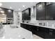 Modern kitchen with granite countertop island, stainless steel appliances, and dark cabinets at 7833 Freestyle Ln, Winter Garden, FL 34787