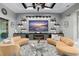 Comfortable living room features modern decor, including stylish couches, shelving, and a modern fireplace at 7833 Freestyle Ln, Winter Garden, FL 34787