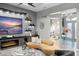 Bright living area with a modern fireplace, media setup, and cozy seating, offering a comfortable atmosphere at 7833 Freestyle Ln, Winter Garden, FL 34787