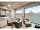 Screened patio with patio seating, ceiling fan, roll down blinds, and fire pit at 7833 Freestyle Ln, Winter Garden, FL 34787
