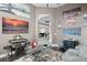 Game and music room features city skyline wall art and seating at 7833 Freestyle Ln, Winter Garden, FL 34787