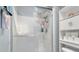 Small bathroom with shower and shelving at 1011 Susan Dr, Lake Wales, FL 33853