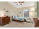 Bright bedroom with a bed, dresser, and window coverings at 1011 Susan Dr, Lake Wales, FL 33853