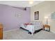 Bedroom with double bed and light purple walls at 1011 Susan Dr, Lake Wales, FL 33853