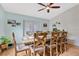 Bright dining room with wood table and chairs, near sliding doors at 1011 Susan Dr, Lake Wales, FL 33853