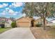 Attractive single-story home with a two-car garage and well-manicured lawn at 1011 Susan Dr, Lake Wales, FL 33853