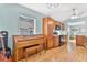 Kitchen features wood cabinets, piano, and vinyl flooring at 1011 Susan Dr, Lake Wales, FL 33853