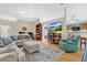 Spacious living room with sectional sofa and a large TV at 1011 Susan Dr, Lake Wales, FL 33853
