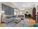 Bright and airy living room with hardwood floors and comfortable seating at 1011 Susan Dr, Lake Wales, FL 33853