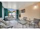 Screened porch with seating, a treadmill, and dartboard at 1011 Susan Dr, Lake Wales, FL 33853