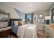 Modern bedroom with geometric wall accents, comfortable bedding, and built-in shelving at 1596 Ellesmere Ave, Haines City, FL 33844