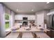 Modern kitchen with white cabinets, stainless steel appliances, and an island at 1596 Ellesmere Ave, Haines City, FL 33844
