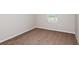 Empty bedroom with neutral walls, brown carpet, and a window at 4018 Gardenia Ave, Lake Hamilton, FL 33851