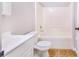 Clean bathroom with tub and shower combo at 525 Lakeview Ct, Kissimmee, FL 34759