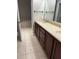 Bathroom with double vanity and tile flooring at 6528 Sedgeford Dr, Lakeland, FL 33811