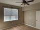 Bedroom with light brown flooring and window blinds at 6528 Sedgeford Dr, Lakeland, FL 33811