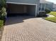 Open garage with brick paver driveway at 6528 Sedgeford Dr, Lakeland, FL 33811