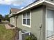 Side view of a house with green exterior and landscaping at 6528 Sedgeford Dr, Lakeland, FL 33811
