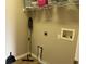 Laundry room with shelving and hook for storage at 6528 Sedgeford Dr, Lakeland, FL 33811