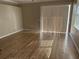 Living room with light brown laminate flooring and sliding glass doors at 6528 Sedgeford Dr, Lakeland, FL 33811
