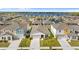 Aerial view of the house and surrounding neighborhood near a lake at 1536 Axel Cir, Winter Haven, FL 33880