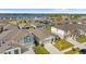Aerial view of the house and surrounding neighborhood near a lake at 1536 Axel Cir, Winter Haven, FL 33880
