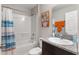 Bathroom with shower/tub combo and granite vanity at 1536 Axel Cir, Winter Haven, FL 33880