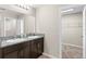 Bathroom with double vanity and walk-in closet at 1536 Axel Cir, Winter Haven, FL 33880