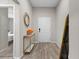 Simple entryway with wood floors and white door at 1536 Axel Cir, Winter Haven, FL 33880