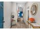 Bright entryway with wood floors and gold accents at 1536 Axel Cir, Winter Haven, FL 33880