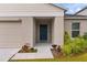 House entrance with a blue door and walkway at 1536 Axel Cir, Winter Haven, FL 33880