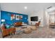 Spacious living room with brown couches and blue accent wall at 1536 Axel Cir, Winter Haven, FL 33880